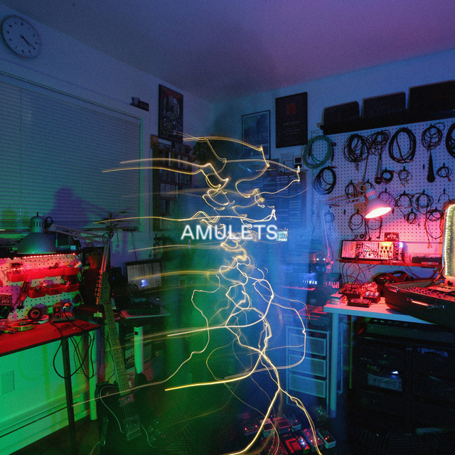 Album artwork for Amulets - Between Distant And Remote